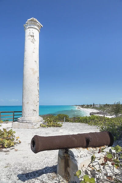 Bahamas, Little Exuma Island. Rusty cannon and column marking salt ponds location