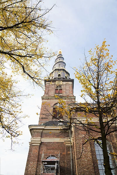 Copenhagen, Denmark - Low angle view of an ornate spire on an old world church. Vertical