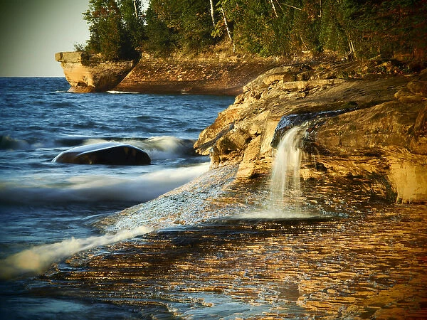 North America, USA, Michigan, Upper Peninsula. Small waterfall along the edge of Lake Superior