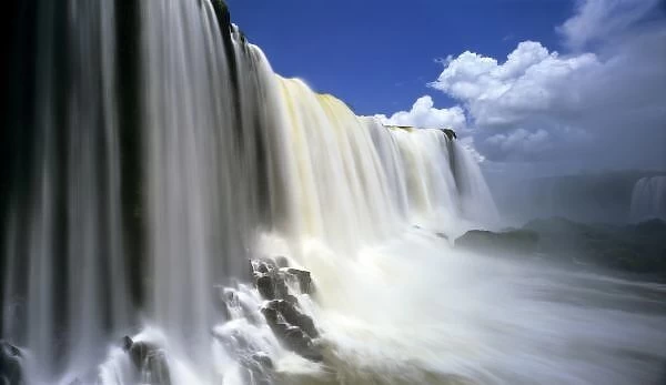 South America, Brazil, Igwacu, Igwacu Falls. Towering Igwacu Falls drops into the Igwacu River