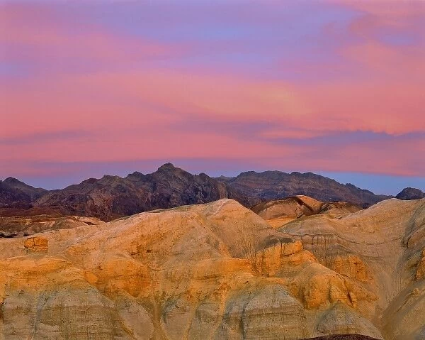 USA, California, Death Valley NP. Sunset colors the sky with vibrant pink and purple