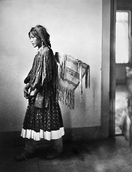 APACHE WOMAN, c1902. A young Apache woman carrying a basket. Photograph by Carl Werntz, c1902