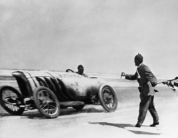 AUTO RACING, 1910. American automobile racer Barney Oldfield setting a record speed of 131. 7 miles-per-hour in his Blitzen Benz, at Daytona Beach, Florida, 1910