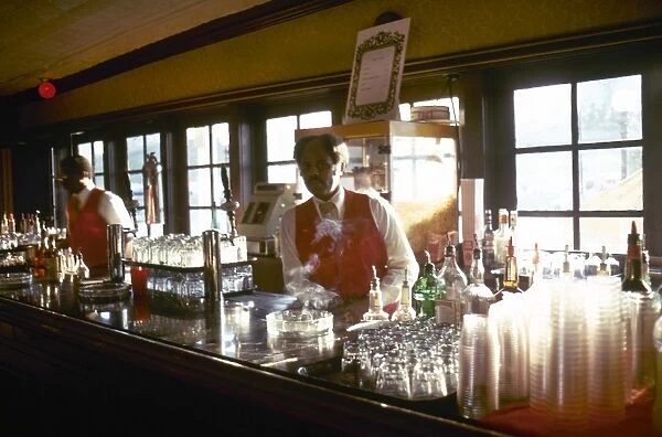 Bartenders working on a showboat on the Mississipi River at St. Louis, Missouri. Photographed c1974