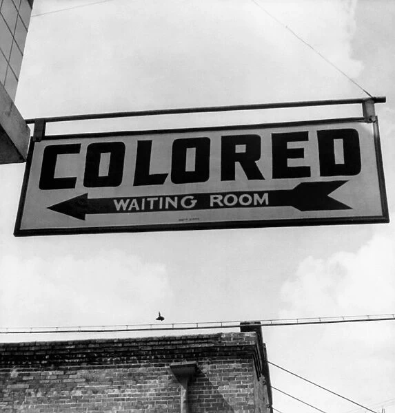 BUS STATION, 1943. The sign for the colored waiting room at a bus station in Rome, Georgia