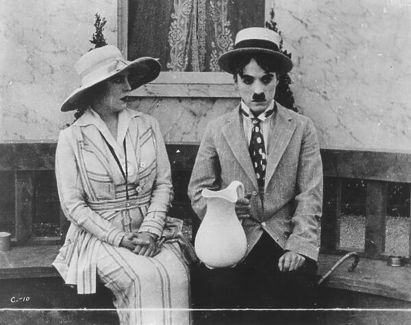 CHAPLIN: THE CURE (1917). Charlie Chaplin and Edna Purviance in The Cure