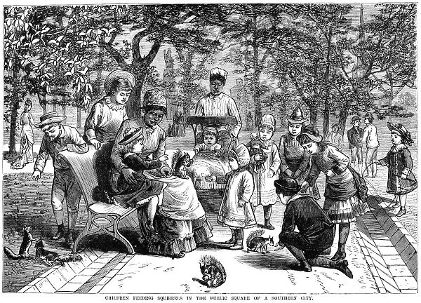 CHILDREN AND NANNIES, 1881. Children feeding squirrels in the public square of city in the American South. Wood engraving, American, 1881