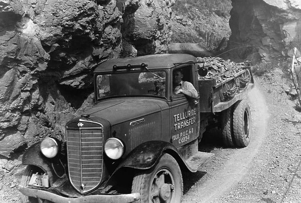 GOLD MINE, 1940. Ore being carried down from the gold mine by truck, Telluride, Colorado