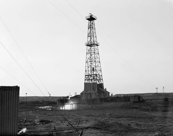IRAQ: OIL DRILL, 1932. A drilling tower at an oil field in Iraq. Photograph, 1932