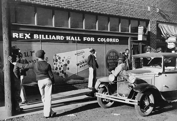 MEMPHIS: BEALE ST. c1939. Men in front of a billiard hall on Beale Street in Memphis, Tennessee