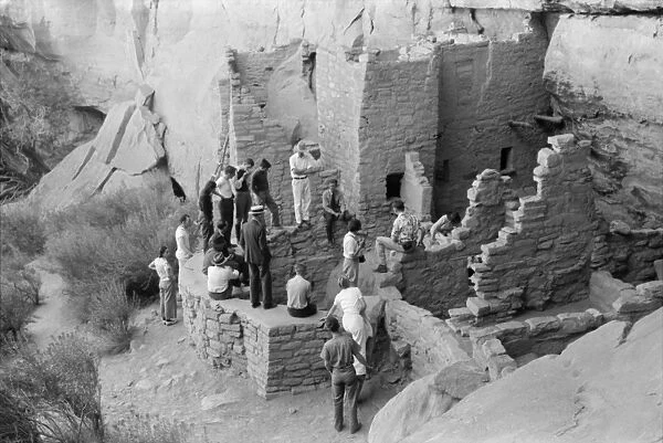 MESA VERDE: TOURISM, 1939. Tourists visiting cliff dwellings at Mesa Verde National Park