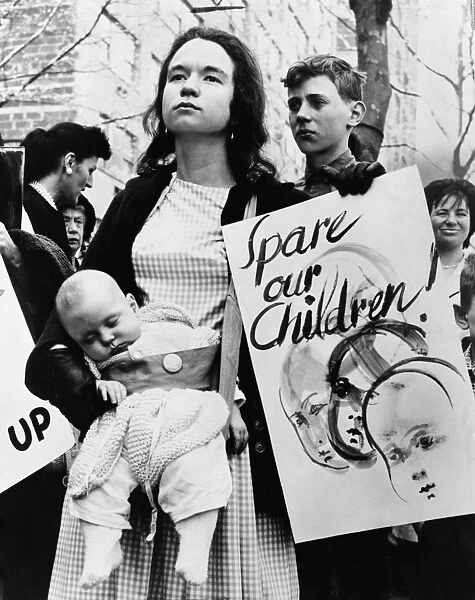 NUCLEAR PROTEST, 1962. Mrs. Donald Davidson and her infant daughter protesting