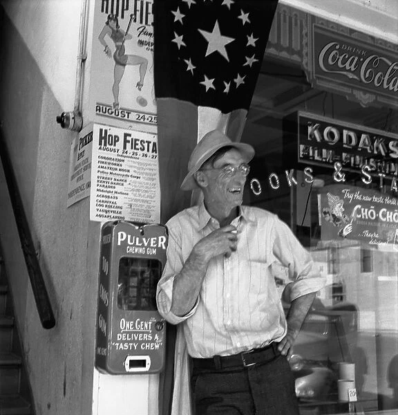 OREGON: MAIN STREET, 1939. A farmer laughing on Main Street of Independence, Oregon