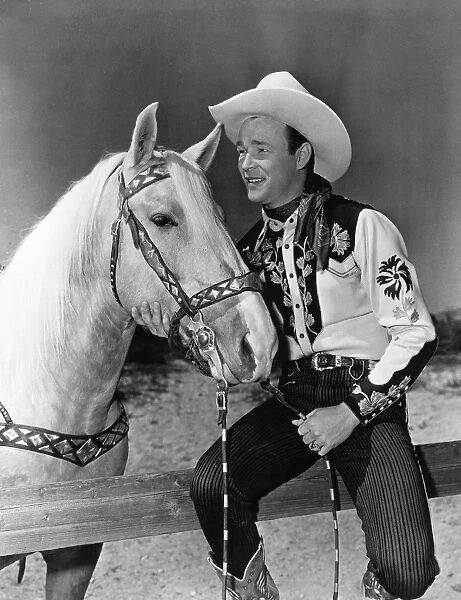 ROY ROGERS (1912-1998). Leonard Slye. American singing cowboy actor. Photographed with his horse Trigger