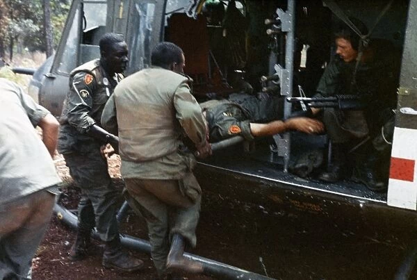 VIETNAM WAR, 1966. Lieutenant Ronald Baker being evacuated by helicopter after
