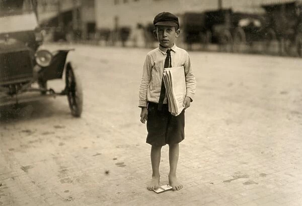 WACO: NEWSBOY, 1913. A eight-year old newboy selling newspapers in Waco, Texas