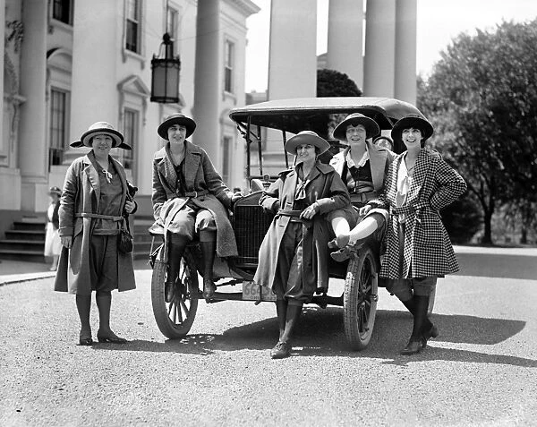 WOMEN WITH AUTOMOBILE. A group of women with an automobile outside the White House in Washington