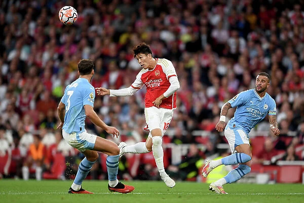 Arsenal vs Manchester City: Tomiyasu Fends Off Walker in Intense Premier League Clash (2023-24)