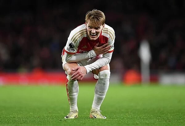 Arsenal's Martin Odegaard Reacts to Injury During Arsenal v West Ham United (2023-24)