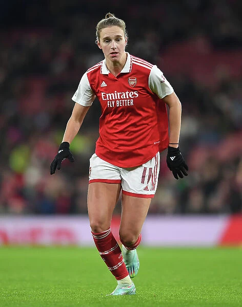Focus and Determination: Kim Little's Pre-Game Ritual in Arsenal FC's Changing Room before Arsenal vs. Olympique Lyonnais, UEFA Women's Champions League, 2022-23