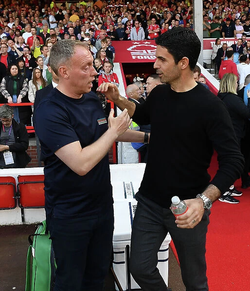 Mikel Arteta and Steve Cooper Embrace Ahead of Nottingham Forest vs. Arsenal Premier League Clash (2022-2023)