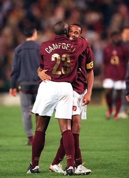 Sol Campbell and Thierry Henry (Arsenal) celebrate at the end of the match