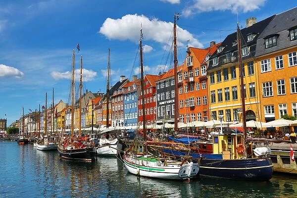 Boats and coloured houses at Nyhavn Quay in Copenhagen, Denmark