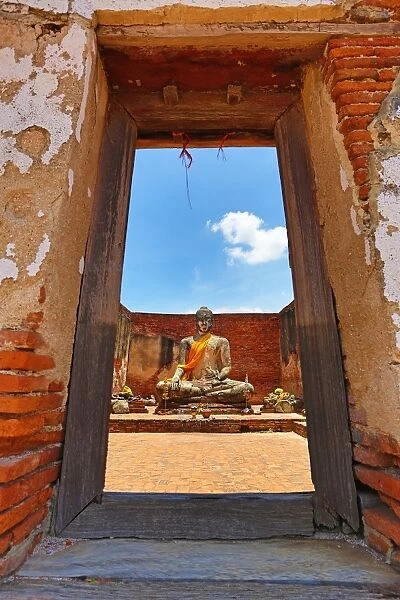 Buddha Statue framed in window frame, Wat Lokayasutharam, Ayutthaya, Thailand