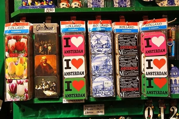 I love Amsterdam souvenir coasters for tourists on sale at a souvenirs stall at the Flower Market in Amsterdam, Holland