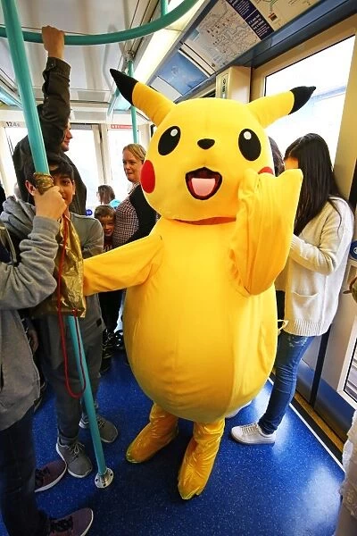 Pikachu rides the DLR to MCM London Comic Con