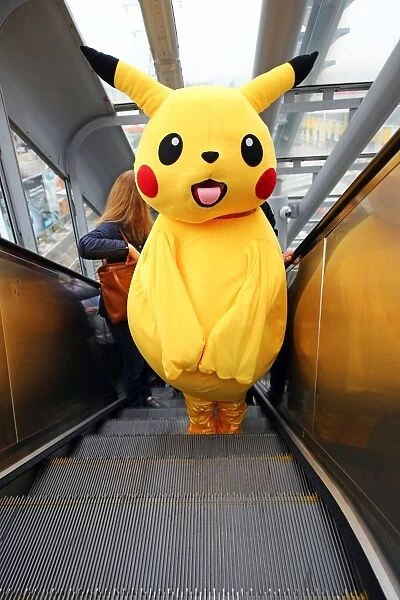 Pikachu rides the DLR to MCM London Comic Con