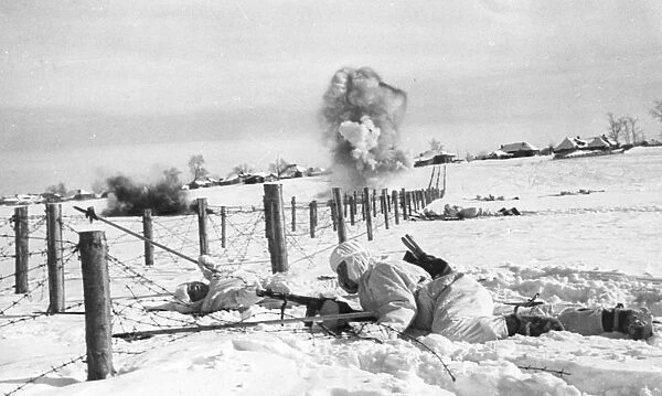 1942: the destruction of an enemys centre of resistance, sappers cutting barbed wire entanglements to clear the way for the infantrys advance