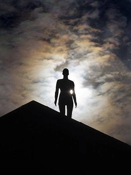 Anthony Gormley man - a public sculpture on a roof in Oxford