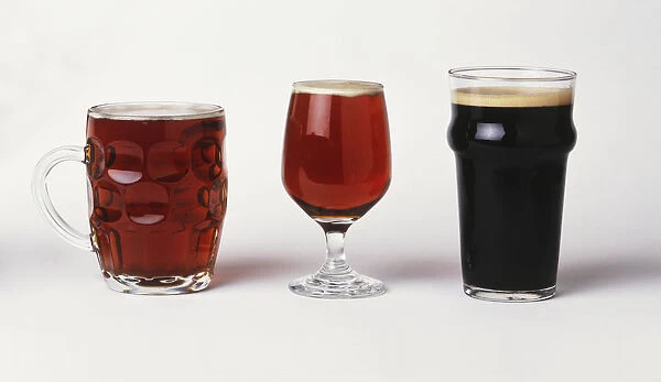 Assorted beers in their special glasses, front view