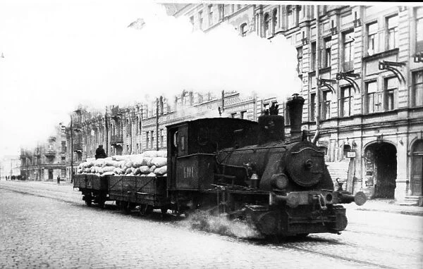 Blockade of leningrad: in the spring of 1942, locomotinves appeared on the street car lines, hauling precious, life-saving bread flour