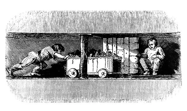 Boy pushing a truck loaded with coal from the coal face to the bottom of the pit shaft