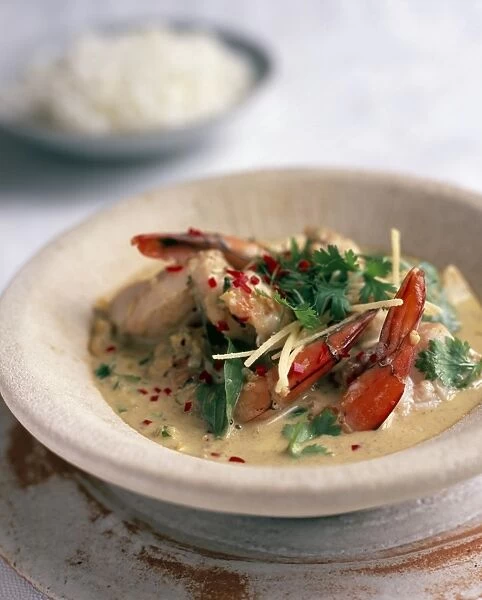 Caro Do Bien, South Vietnamese seafood curry, garnished with chilli, ginger and Thai basil and coriander leaves