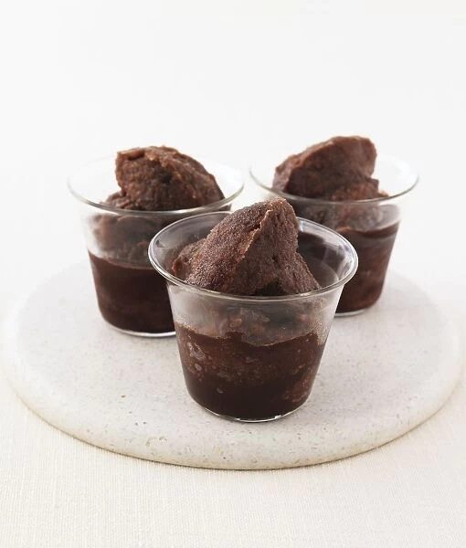 Chocolate mocha sorbets in glass bowls on place mat