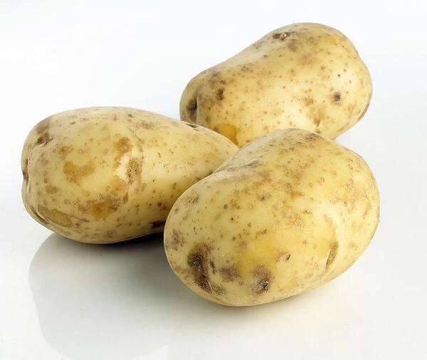 Close-up of three potatoes