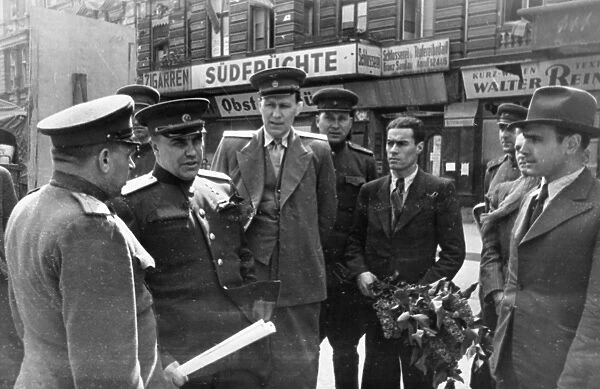 Colonel-general berzarin, soviet commandant of berlin (second from left) chatting with officials of the berlin subway after a ride on the underground railway, 1945 or 1946