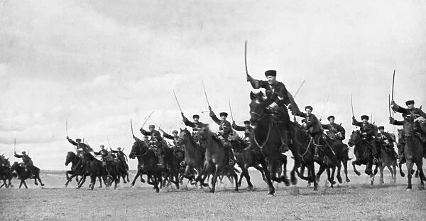 A cossack cavalry unit charging with sabres drawn on the crimean front, may 1942