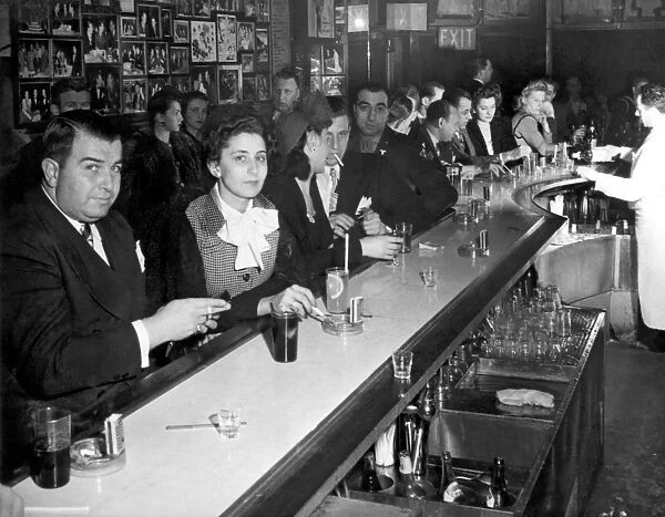 A crowded and smokey bar scene in the WWII era
