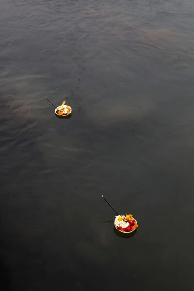 Diyas (floral floats with incense) floating on the Ganges