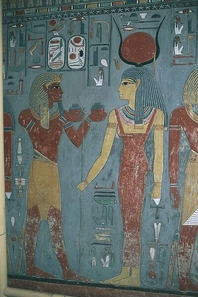 Egypt, Luxor, Valley of Kings, wall painting with Horemheb between godess Isis and god Horus in Tomb of Horemheb