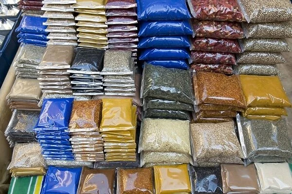 Egypt, Luxor, various spices in plastic bags for sale in the souq