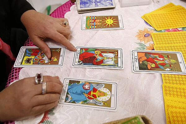 Fortuneteller Laying Cards on the Table