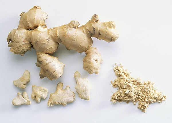 Fresh and dried ginger rhizomes and ground ginger, close up