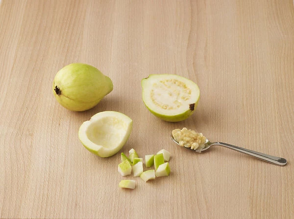 Guavas, whole and sliced with seeds scooped out