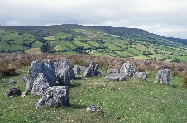 Ireland, Neolithic tomb and lush rolling landscape