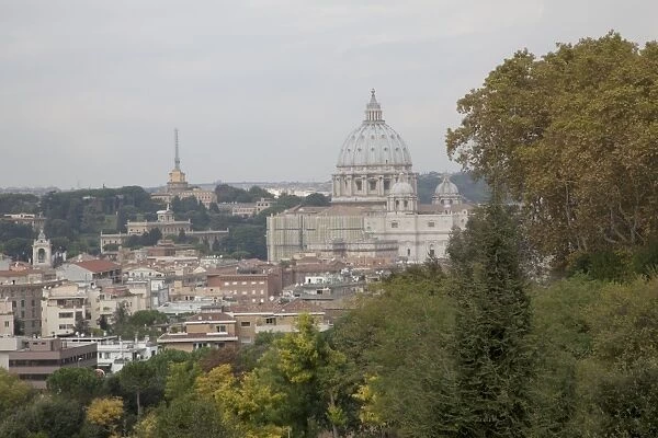 Italy, Rome, Vatican City and St. Peters Basilica seen from Piazza Garibaldi in the Janiculum